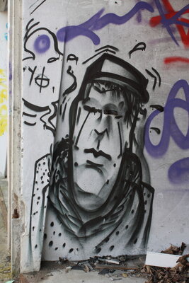 Graffiti bildlich: Mann mit Hut